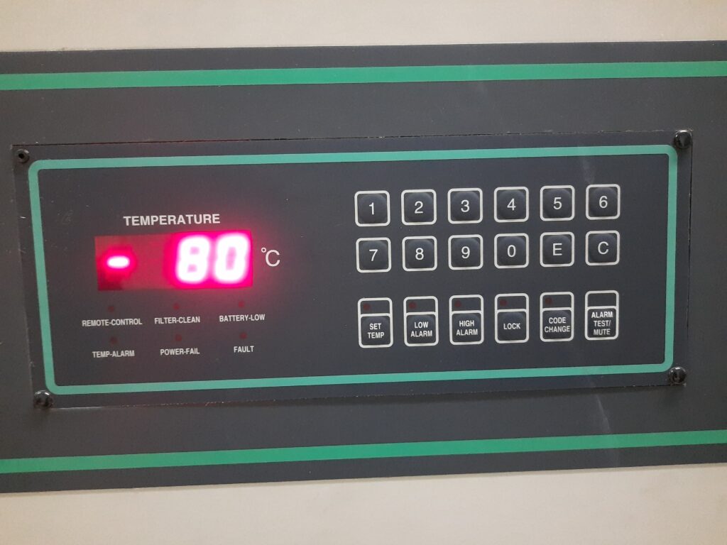 Digital control panel of an ultra-low temperature laboratory freezer displaying a steady operating temperature of-80^0C